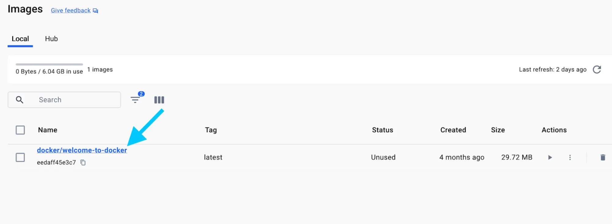 A screenshot of the Docker Desktop Dashboard showing the images view with an arrow pointing to the docker/welcome-to-docker image